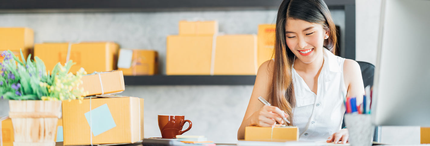 lady writing on package