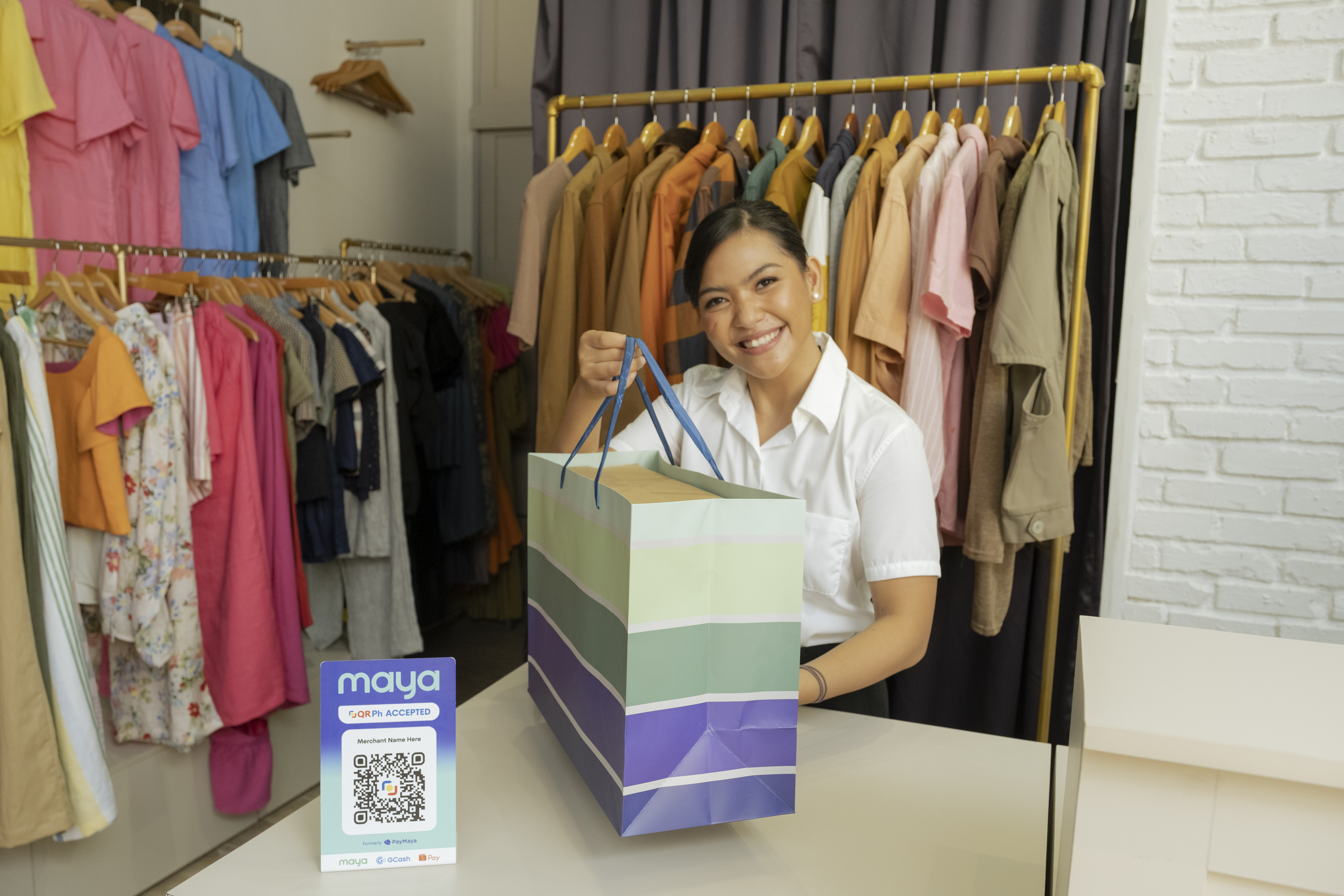 woman holding product paper bag