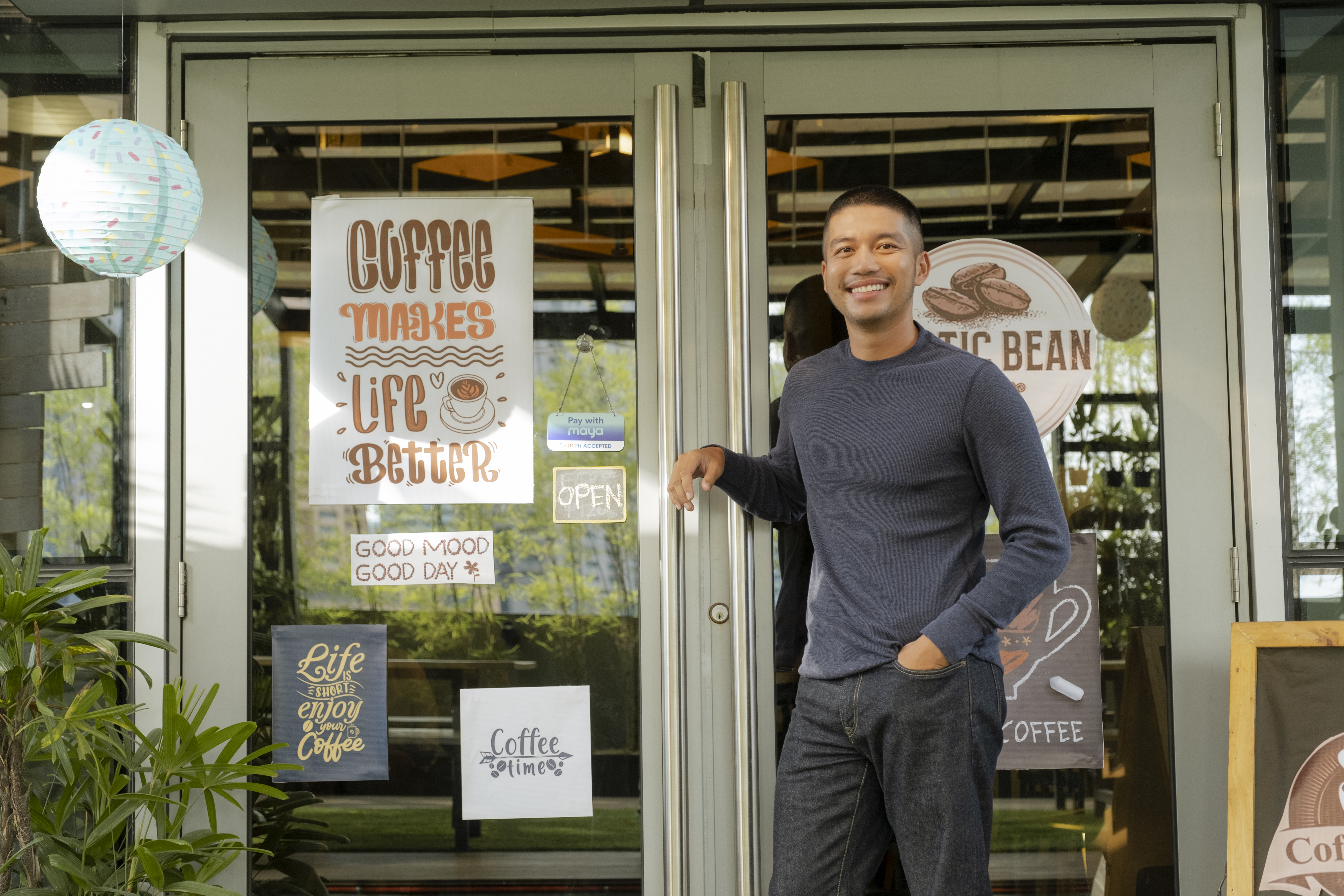 man in front of coffee shop