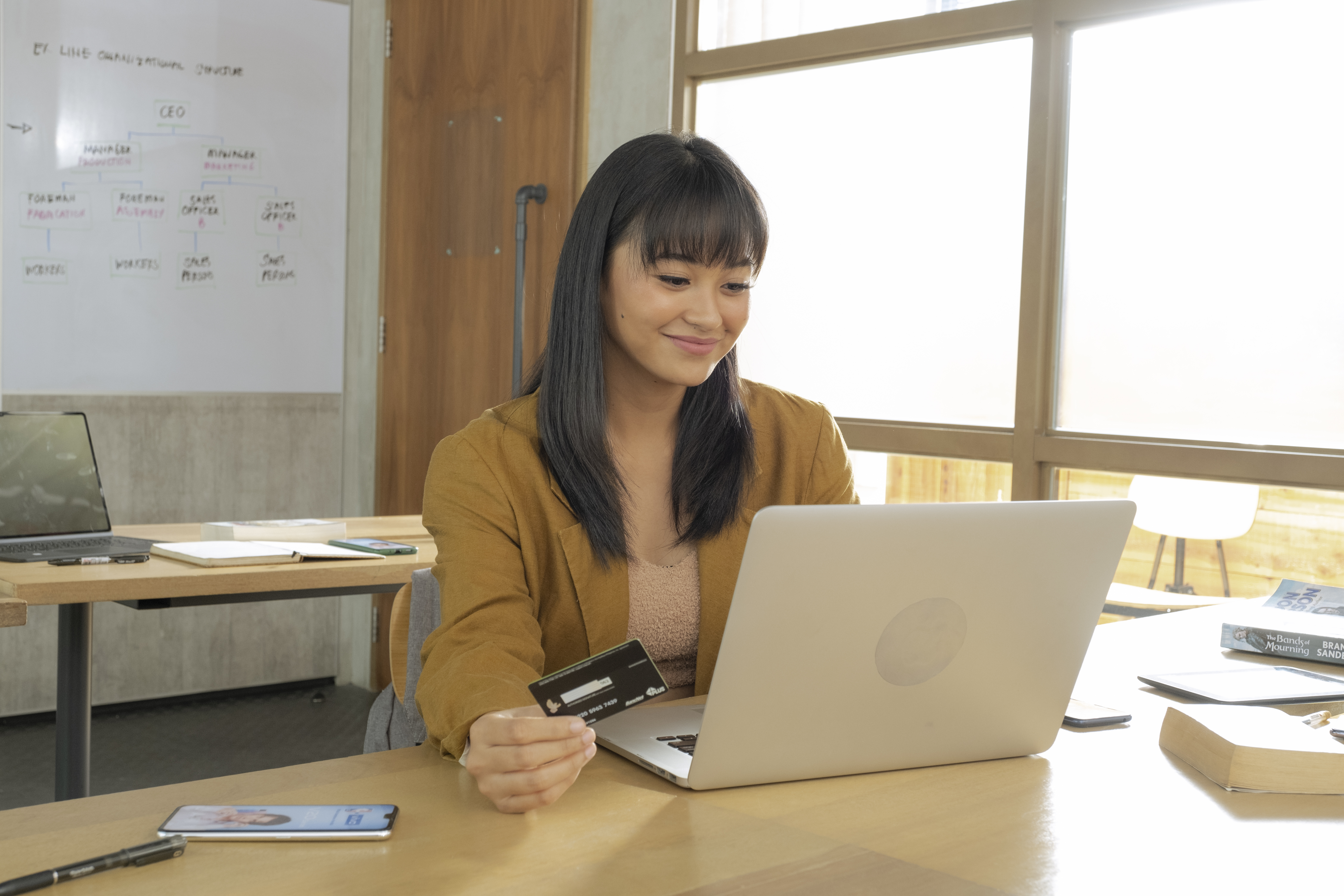 office lady holding maya card